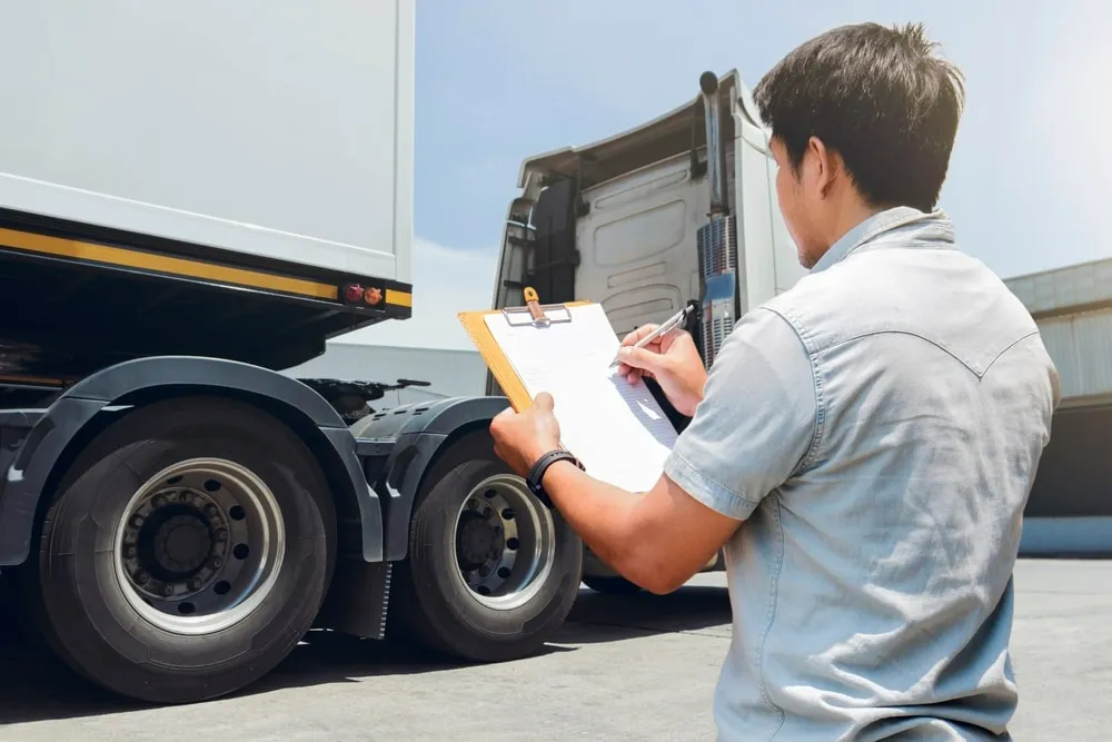 A checklist being used for a pre-trip inspection of a truck.